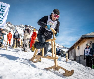 person riden wooden ski bike person riden wooden ski bike