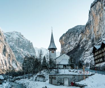 Beautiful church and mountains in village Beautiful church and mountains in village