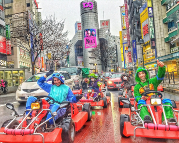 Tourists participating in Mario Kart in the streets of Tokyo Tourists participating in Mario Kart in the streets of Tokyo
